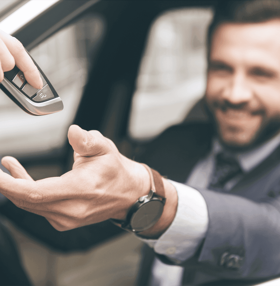 Driver getting keys after purchasing a car